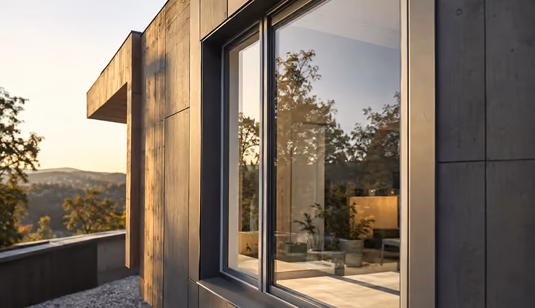 Large window set into a dark facade